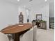 Dining room with oval wooden table and light-grey cushioned chairs at 32588 Tree Of Life Ave, Wesley Chapel, FL 33543