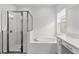 Clean bathroom with a soaking tub and walk-in shower at 32588 Tree Of Life Ave, Wesley Chapel, FL 33543