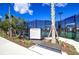 Well-maintained tennis courts with rules posted at 32588 Tree Of Life Ave, Wesley Chapel, FL 33543