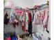 Organized closet with hanging rods and shelving for clothes and shoes at 32588 Tree Of Life Ave, Wesley Chapel, FL 33543