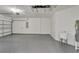 Bright garage with utility sink and epoxy flooring at 5224 Mango Fruit St, Seffner, FL 33584