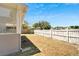 Backyard with wooden fence and grassy area at 5224 Mango Fruit St, Seffner, FL 33584