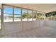 Spacious sunroom with large windows and tile floors at 5224 Mango Fruit St, Seffner, FL 33584