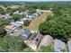 Aerial view of a house with solar panels, located in a quiet neighborhood at 5224 Mango Fruit St, Seffner, FL 33584