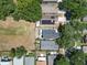 Aerial view of a house with solar panels and a large backyard at 5224 Mango Fruit St, Seffner, FL 33584