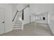 Bright and spacious interior with modern staircase and open floor plan at 5224 Mango Fruit St, Seffner, FL 33584