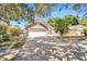 Single story home with a two car garage and a well maintained lawn at 5224 Mango Fruit St, Seffner, FL 33584