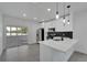 Modern kitchen, stainless steel appliances, white cabinets, and quartz countertops at 5224 Mango Fruit St, Seffner, FL 33584