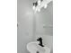 Modern bathroom sink with sleek black faucet and mirror at 5224 Mango Fruit St, Seffner, FL 33584
