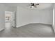 Bright bedroom with ceiling fan and access to another room at 5224 Mango Fruit St, Seffner, FL 33584