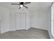 Spacious bedroom with double doors and ceiling fan at 5224 Mango Fruit St, Seffner, FL 33584