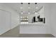 Modern white kitchen with stainless steel appliances and quartz countertops at 5224 Mango Fruit St, Seffner, FL 33584