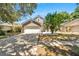 Two-story home with gray exterior, attached garage, and landscaped yard at 5224 Mango Fruit St, Seffner, FL 33584