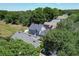 Aerial view of houses with solar panels in a tree-lined neighborhood at 5224 Mango Fruit St, Seffner, FL 33584