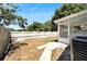 Backyard with walkway, wooden fence, and AC unit at 5224 Mango Fruit St, Seffner, FL 33584
