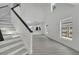 Bright living room with high ceilings and gray wood-look floors at 5224 Mango Fruit St, Seffner, FL 33584