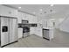 Modern kitchen with stainless steel appliances and white cabinets at 5224 Mango Fruit St, Seffner, FL 33584