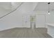Open concept living room with high ceilings and gray floors at 5224 Mango Fruit St, Seffner, FL 33584