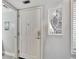 Bright entryway with white door and mirrored accent at 1028 Apollo Beach Blvd # 27, Apollo Beach, FL 33572