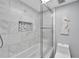 Marble-tiled bathroom with a shower and bathtub at 1028 Apollo Beach Blvd # 27, Apollo Beach, FL 33572