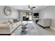 Bright living room with comfy sofas and patio access at 1028 Apollo Beach Blvd # 27, Apollo Beach, FL 33572
