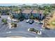 Condo building exterior with parking and landscaping at 1028 Apollo Beach Blvd # 27, Apollo Beach, FL 33572