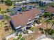 Condo building's rear with private patio and screened enclosure at 1028 Apollo Beach Blvd # 27, Apollo Beach, FL 33572
