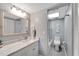 Bathroom with a white vanity, bathtub, and gray walls at 1028 Apollo Beach Blvd # 27, Apollo Beach, FL 33572