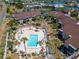 Community pool area with surrounding patio furniture and landscaping at 1028 Apollo Beach Blvd # 27, Apollo Beach, FL 33572
