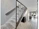 Modern staircase with metal railing and gray accents at 1028 Apollo Beach Blvd # 27, Apollo Beach, FL 33572