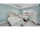 Guest bedroom with twin beds and white dresser at 1028 Apollo Beach Blvd # 27, Apollo Beach, FL 33572