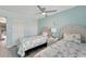 Guest bedroom with twin beds and white closet doors at 1028 Apollo Beach Blvd # 27, Apollo Beach, FL 33572