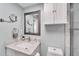 Bathroom with a vanity, toilet, and decorative mirror at 1028 Apollo Beach Blvd # 27, Apollo Beach, FL 33572