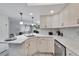 Kitchen with white cabinets and granite countertops at 1028 Apollo Beach Blvd # 27, Apollo Beach, FL 33572