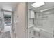 Modern bathroom with a shower/tub combo, vanity, and tiled walls at 1028 Apollo Beach Blvd # 27, Apollo Beach, FL 33572