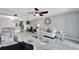 Bright living room with comfy seating, large windows, and a stylish rug at 1028 Apollo Beach Blvd # 27, Apollo Beach, FL 33572