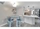 Kitchen features a breakfast bar and white cabinets at 1028 Apollo Beach Blvd # 27, Apollo Beach, FL 33572