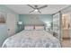 Serene main bedroom with king-size bed and sliding barn door to bathroom at 1028 Apollo Beach Blvd # 27, Apollo Beach, FL 33572