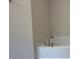 Soaking tub with modern faucet and neutral wall colors at 36188 Welsh Glade Rd, Dade City, FL 33525