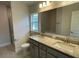 Bathroom with double vanity, granite countertop, and shower at 36188 Welsh Glade Rd, Dade City, FL 33525