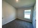 Spacious bedroom with carpeted floor and large window at 36188 Welsh Glade Rd, Dade City, FL 33525