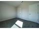 Well-lit bedroom with carpet and two doors at 36188 Welsh Glade Rd, Dade City, FL 33525