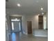 Open entryway with tile floors and views to the living and kitchen areas at 36188 Welsh Glade Rd, Dade City, FL 33525
