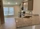 Modern kitchen with granite countertops and stainless steel appliances at 36188 Welsh Glade Rd, Dade City, FL 33525