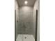 Large walk-in shower with glass enclosure and grey tile at 36188 Welsh Glade Rd, Dade City, FL 33525