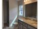 Modern bathroom with double vanity, granite countertop, and a soaking tub at 36158 Welsh Glade Rd, Dade City, FL 33525