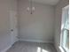 Bright dining area with tile flooring and a chandelier at 36158 Welsh Glade Rd, Dade City, FL 33525