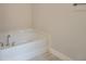 Relaxing corner soaking tub in a clean bathroom at 36158 Welsh Glade Rd, Dade City, FL 33525