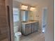Bright bathroom boasts double vanity and a walk-in shower at 36158 Welsh Glade Rd, Dade City, FL 33525