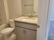Guest bathroom with granite vanity and tile floor at 36158 Welsh Glade Rd, Dade City, FL 33525